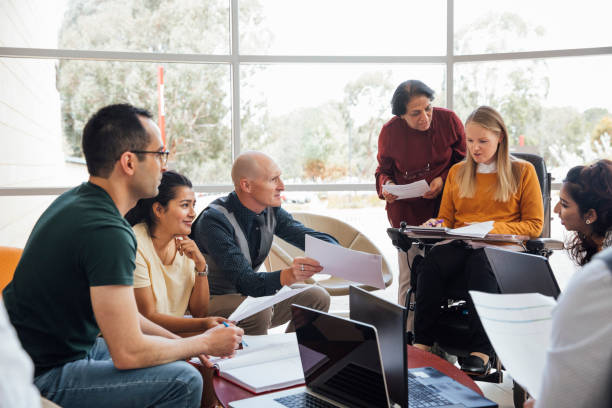 istock Diverse Group of Scientists in Group Discussion 1203934273