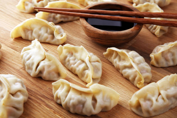 istock Gyoza or dumplings snack with soy sauce. 1203935131