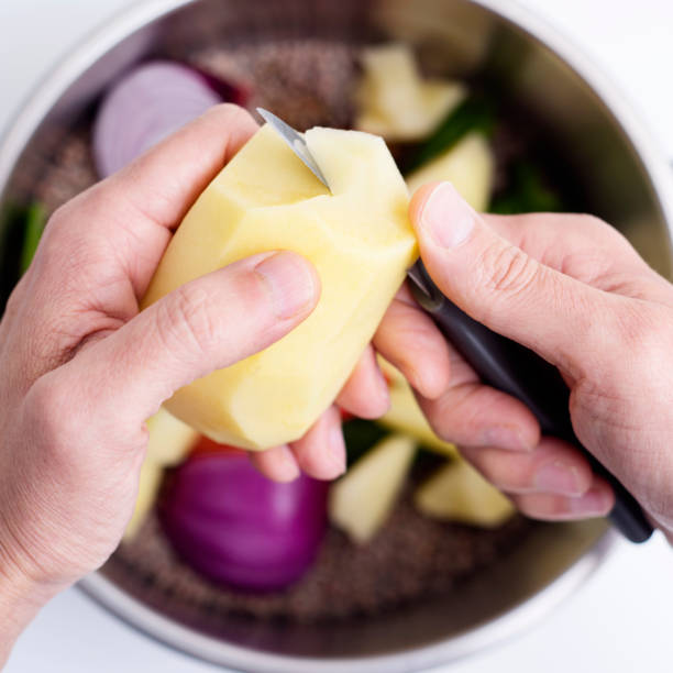 istock man preparing a vegetarian lentil stew 1203935851