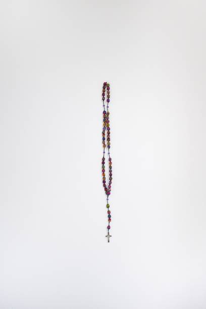 istock Colorful handmade rosary hanging against white wall 1203937256
