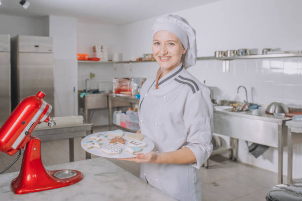 istock Female sugar baker is decoration 1203937283