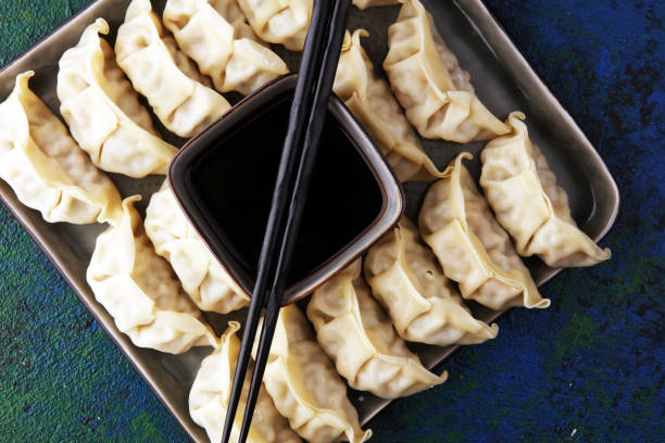 istock Gyoza or dumplings snack with soy sauce. 1203937458
