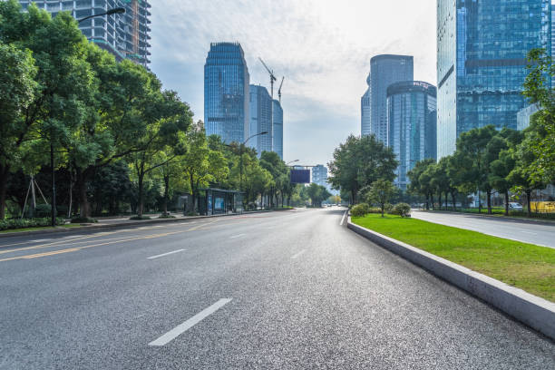 city road through modern buildings in beijing - defocused blurred motion road street imagens e fotografias de stock