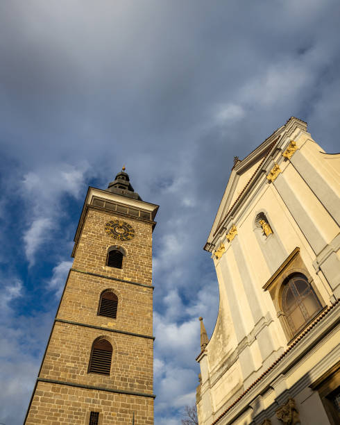 istock Black Tower with clock and dramatic cloudy sky in Ceske Budejovice 1203942118