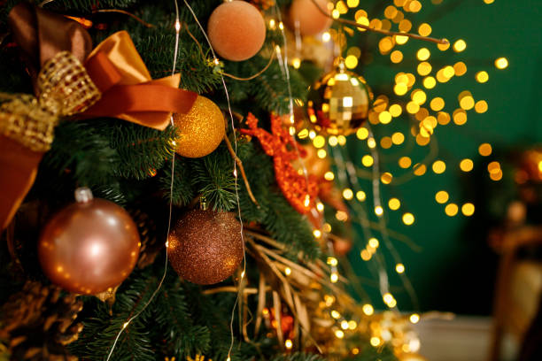 istock Christmas tree decorated with beautiful toys on a studio background 1203943940