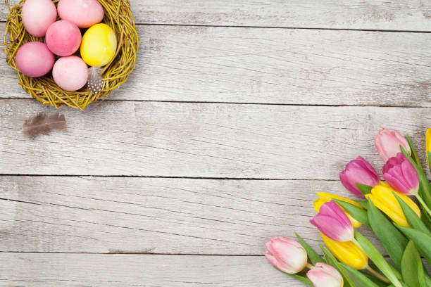 istock Easter greeting card with eggs and tulips 1203947500