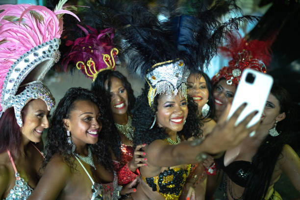 istock Woman (passistas) taking a selfie celebrating brazilian carnival 1203949708