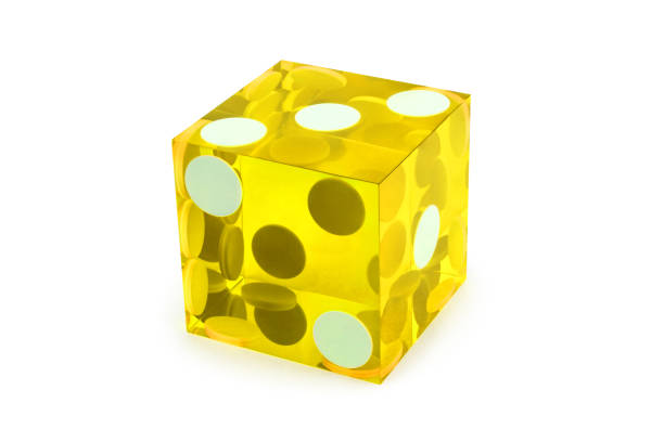 istock Macro yellow dice isolated on white / result as three on top with a light shadow 1203950202