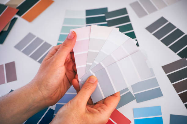 istock Woman hands choosing colour in sample palettes. 1203955151