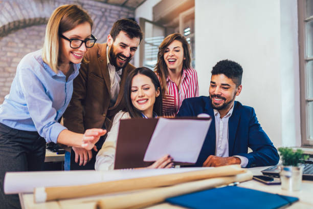 istock Business people working together in modern office. 1203955326