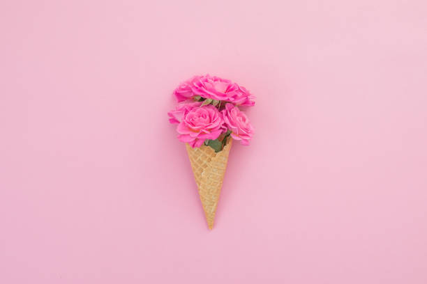 istock Valentines day composition with pink roses flowers on pink background. Flat lay, top view. 1203956094