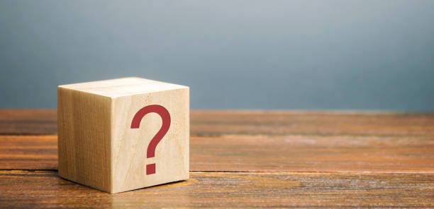Wooden block with a question mark. Asking questions, searching for truth. Riddle mystery, investigation and research. FAQ - frequently asked questions. Search for information. Q&A Wooden block with a question mark. Asking questions, searching for truth. Riddle mystery, investigation and research. FAQ - frequently asked questions. Search for information. Q&A riddle stock pictures, royalty-free photos & images