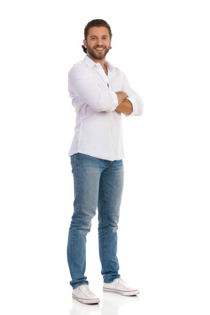 istock Handsome Man Is Standing With Arms Crossed And Looking At Camera 1203956578