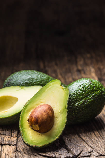 istock Fresh avocado on rustic wooden table - Close up 1203956718