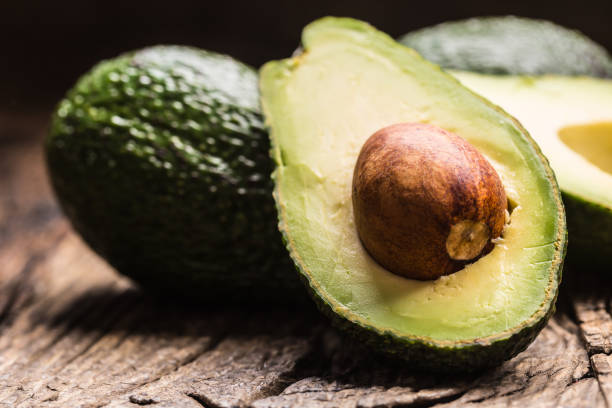 istock Fresh avocado on rustic wooden table - Close up 1203956720