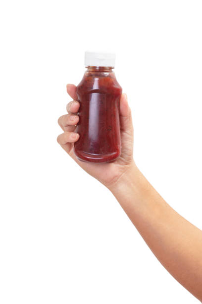 istock Hand Holding  with Variety of sauces 1203957032