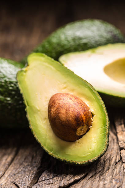 istock Fresh avocado on rustic wooden table - Close up 1203957074