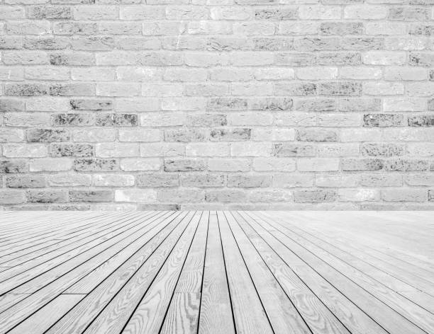istock light gray and white bricks on the wall and white wooden floor decoration. Texture and background concept. 1203958084