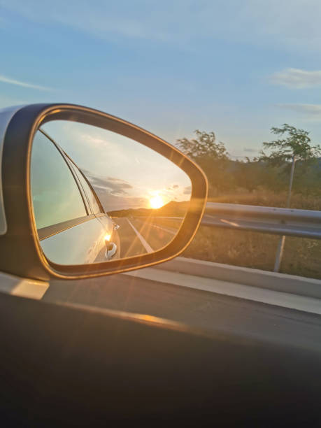 istock Sunset in mirror of a car 1203958661