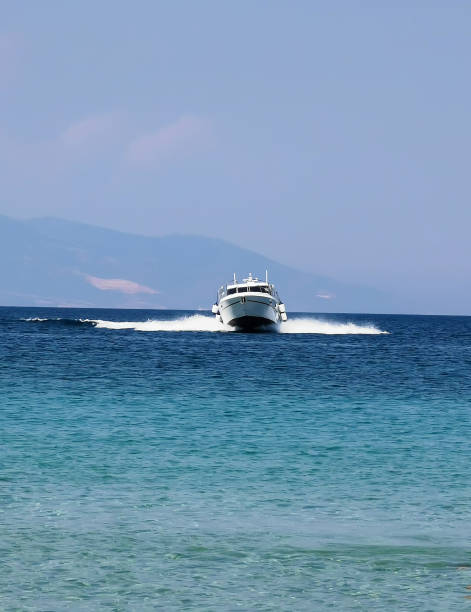 Speedboat cruising over sea and make wawes