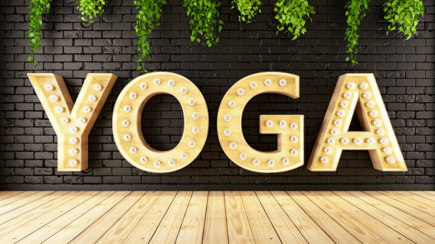 istock Yoga Light Bulb Sign on Black Brick Wall 1203958955