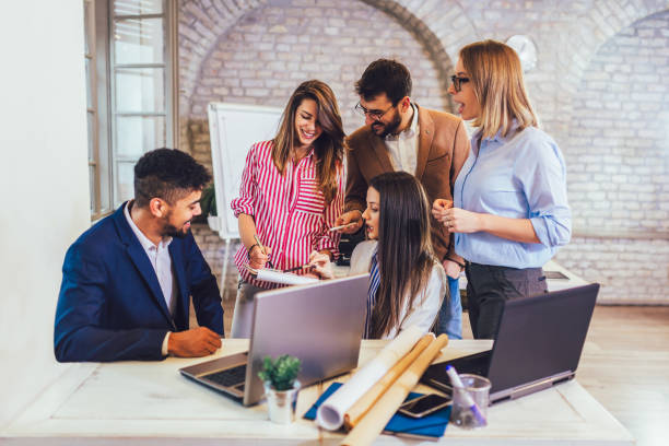 istock Business people working together in modern office. 1203959109