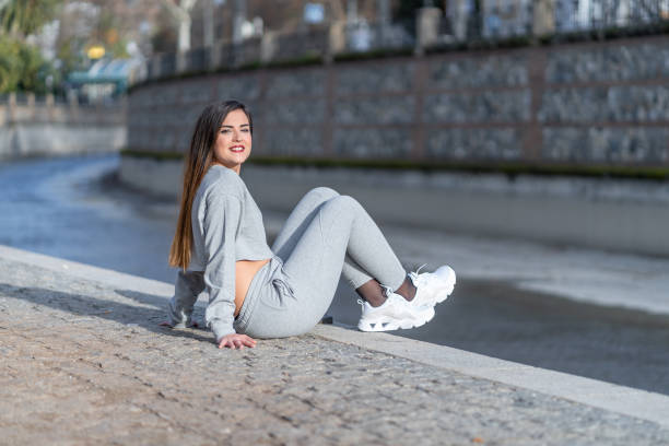 Woman sitting on the edge of the river