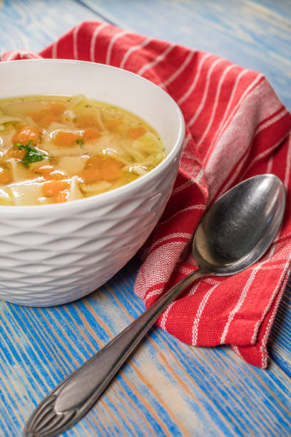 istock Broth - chicken soup in a bowl. 1203959388