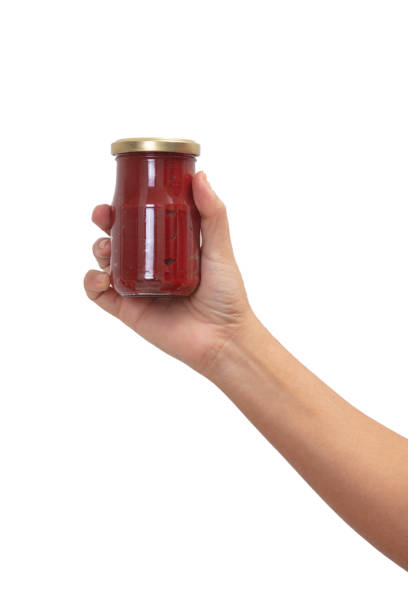 istock Hand Holding  with Variety of sauces 1203959963