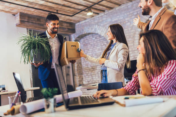 istock Black man having first working day getting acquainted with colleagues 1203960319