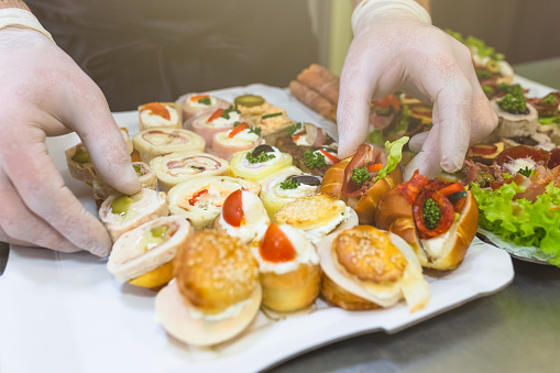 Buffet meal preparation and serving at restaurant.