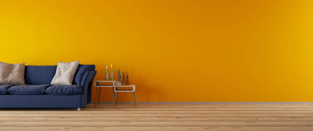 intérieur jaune de salle de séjour avec panorama de sofa - orange wall photos et images de collection