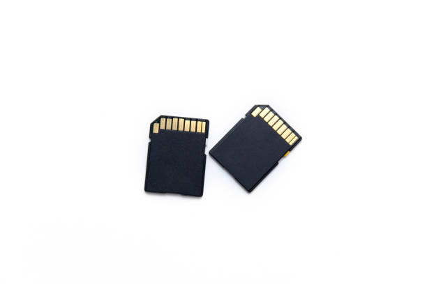 istock Two black SD memory cards isolated on a white background 1203960838