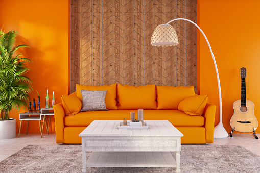 Modern living room with orange walls