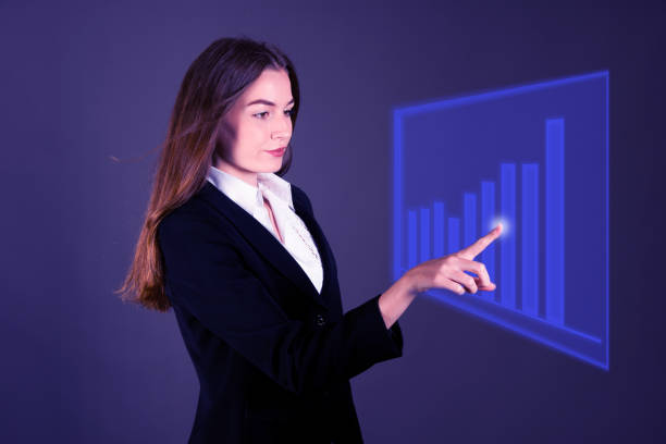 istock Attractive young business woman pressing virtual button over gray background 1203961878