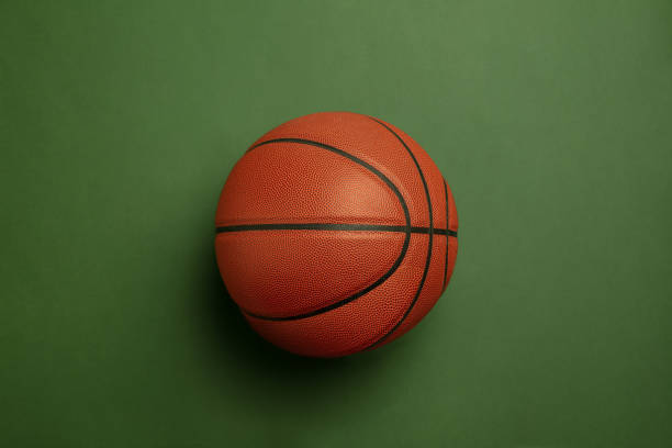 istock Sport equipment isolated on green studio background 1203963916