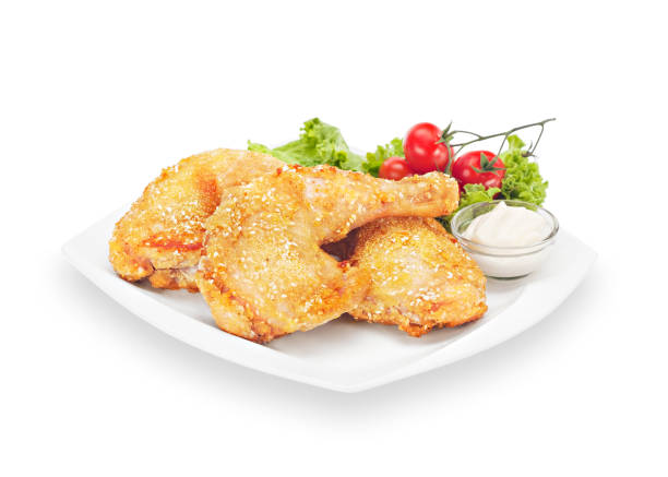 istock Delicious Crispy chicken quarter in batter with cherry tomato 1203965109