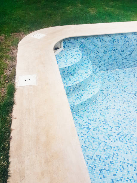 istock Empty swimming pool end of the summer season 1203965167