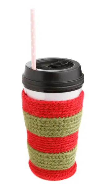 Travel thermos with Christmas hand-knitted cover and straw isolated on white background