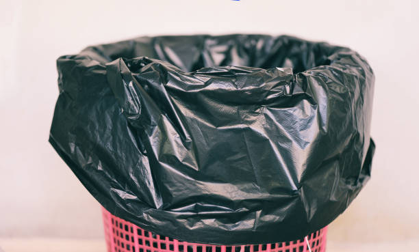 istock Waste bin , garbage waste and bag plastic black - recycle bin on wall background 1203965656