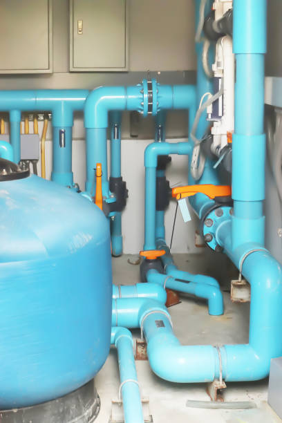 istock Image background of inside mechanical room of pipeline system for swimming pool. 1203965670