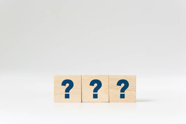 istock Wooden cube block shape with sign question mark symbol on white background 1203966117