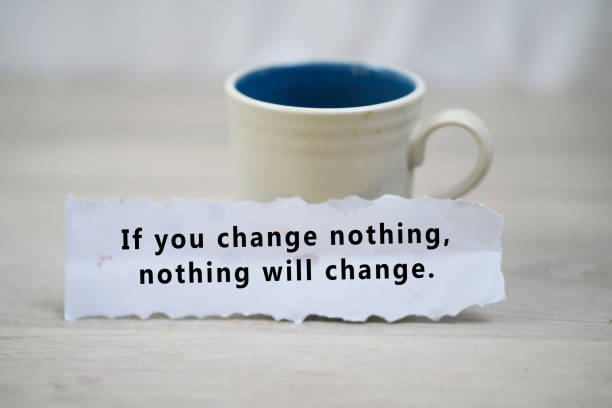 Note on paper - If you change nothing, nothing will change. Inspirational quote - Be kind to yourself today. Happy Tuesday. With a cup of morning coffee and a white paper note concept on white wooden table background. Tuesday coffee and motivational words concept. motivation photos stock pictures, royalty-free photos & images