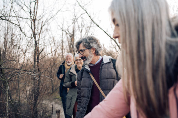 istock Group of seniors enjoying the nature while hiking 1203967837