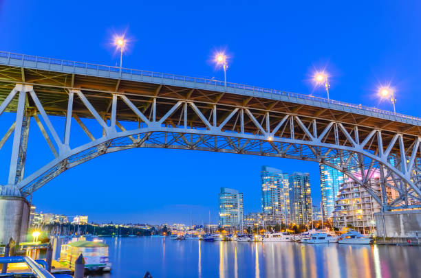 istock Granville Bridge and Vancouver BC skyline reflection at blue hour in Canada 1203967838