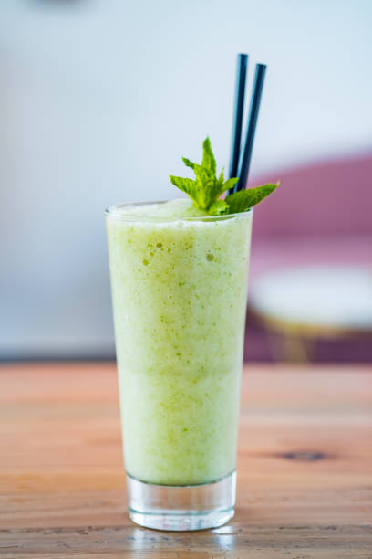 istock Healthy green smoothie from apples, spinach and kiwi with mint. 1203967839