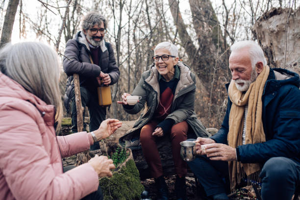 istock Seniors on hiking taking a rest and drinking coffee 1203968898