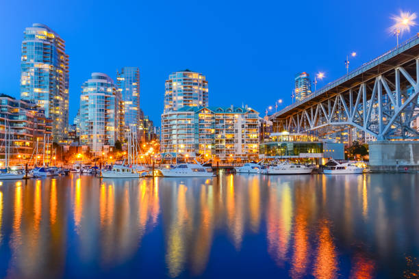 istock Vancouver BC skyscrapers and Granville Bridge reflection along False Creek at blue hour 1203969077