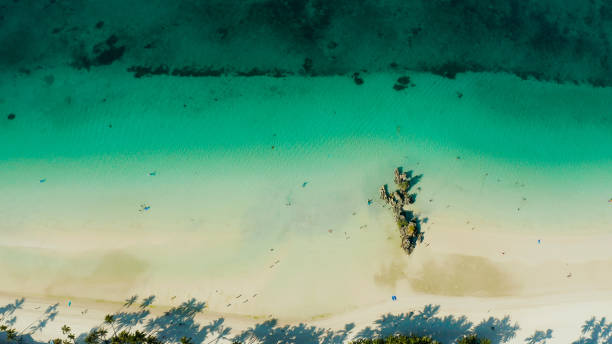 istock Tropical beach and blue clear sea 1203970631