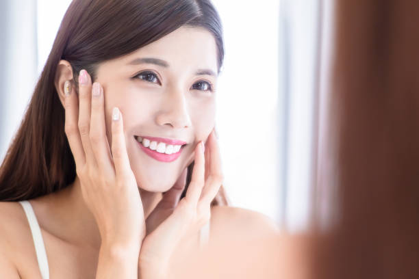 istock skin care girl touch face 1203971789